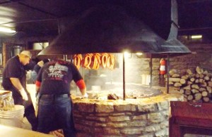 Salt Lick's Pit and Pitmaster.  Ribs and brisket are on the grill.  Sausages are up high.