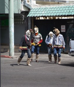 Dancers.  Is That Macaroni on their Legs?  Those Are Spent Shotgun Shell Belts.